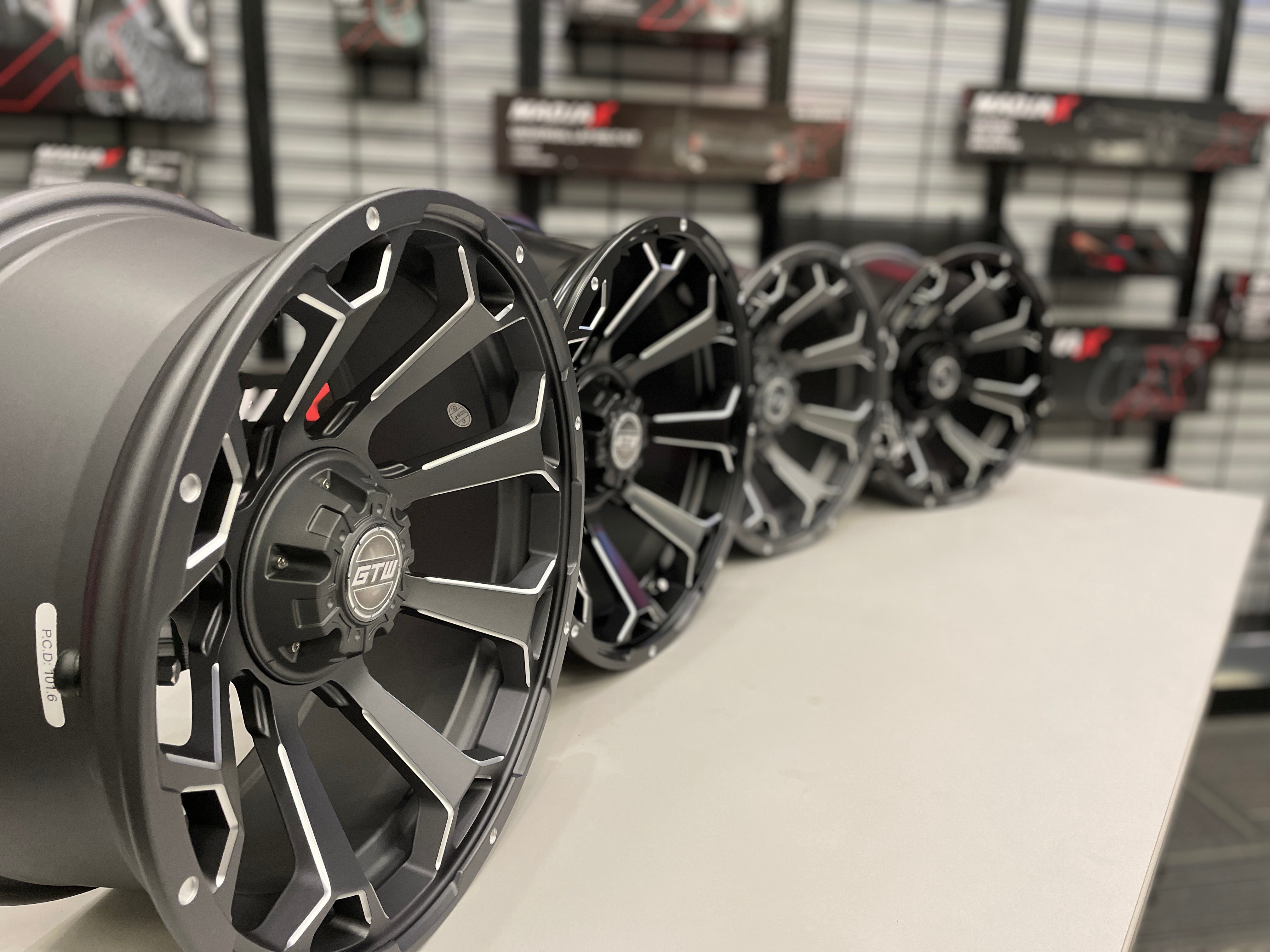 15-Inch GTW Raven Matte Black Wheels with 23' GTW Nomad All-Terrain Tires (Set of 4)